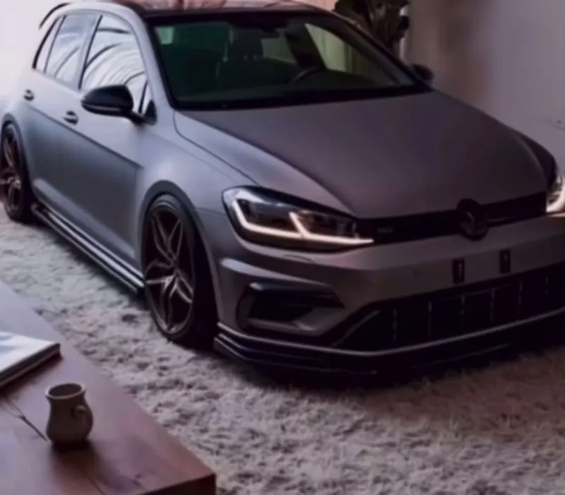 Grey Volkswagen Golf R parked indoors, from a Prestige Pro Instagram reel