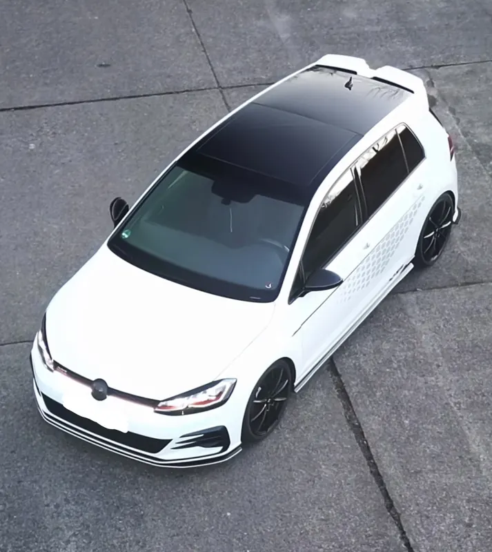 White Volkswagen Golf with a black roof, seen from above